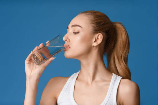 a woman drinking water 